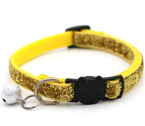 Adjustable yellow glitter cat collar with bell and black buckle.